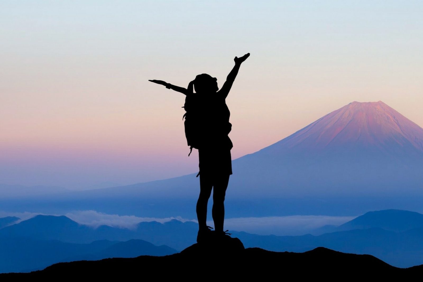 a person standing on a mountain