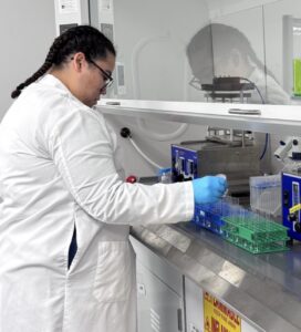 A Harrisburg University student working in a chemistry lab.