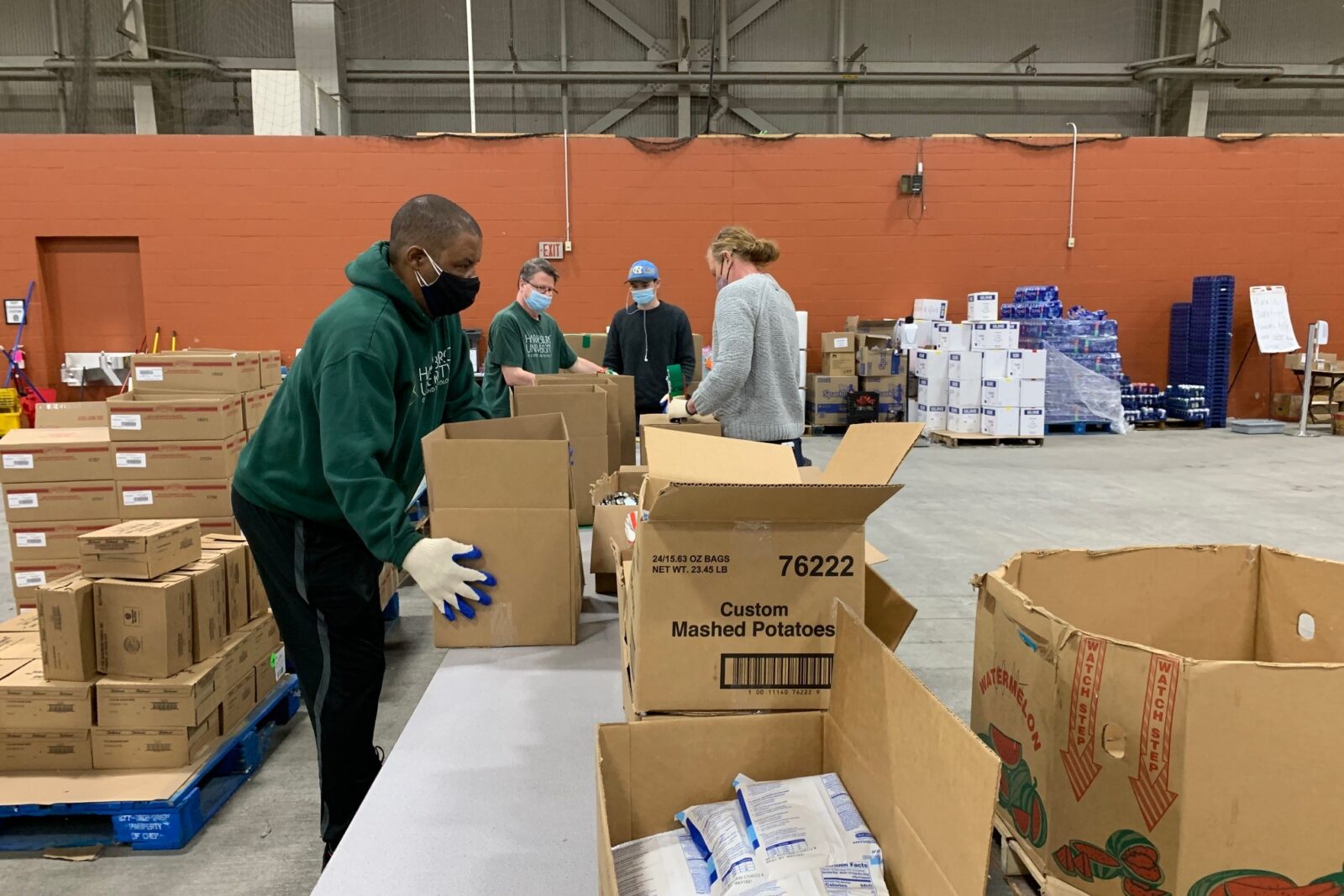a group of people in a warehouse