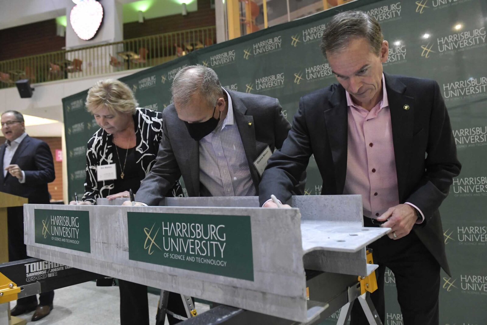 people standing at a podium