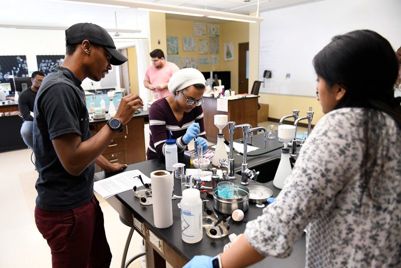a group of people working in a lab