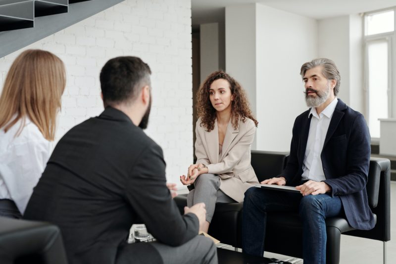 a group of people sitting in chairs
