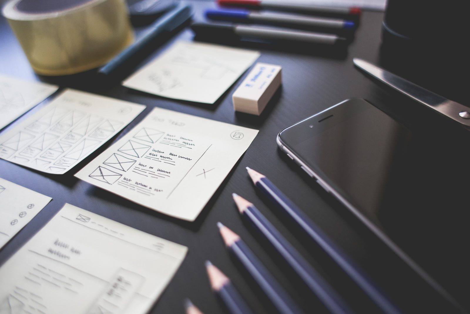 a close-up of a desk with papers and a phone