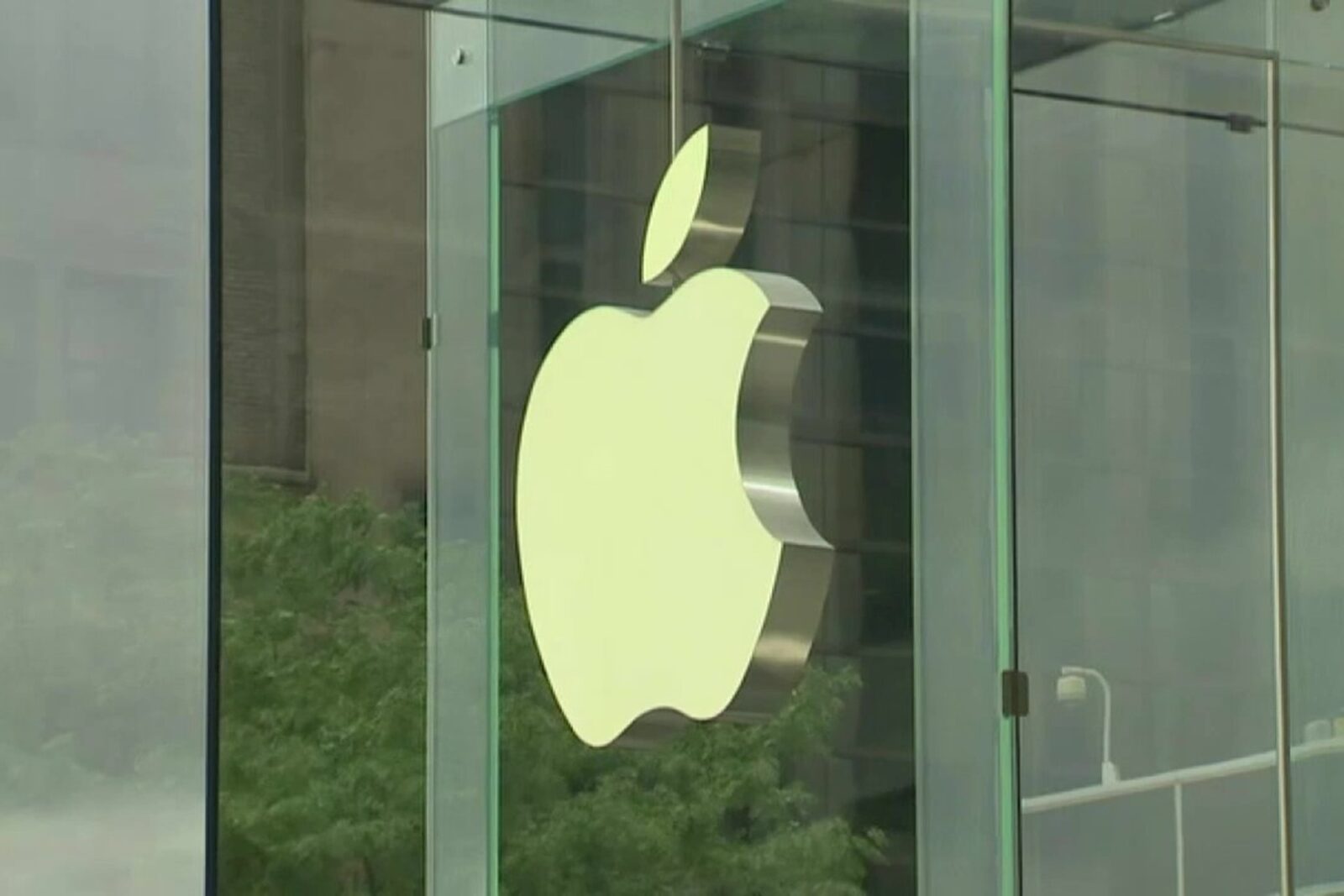 a glass door with an apple symbol