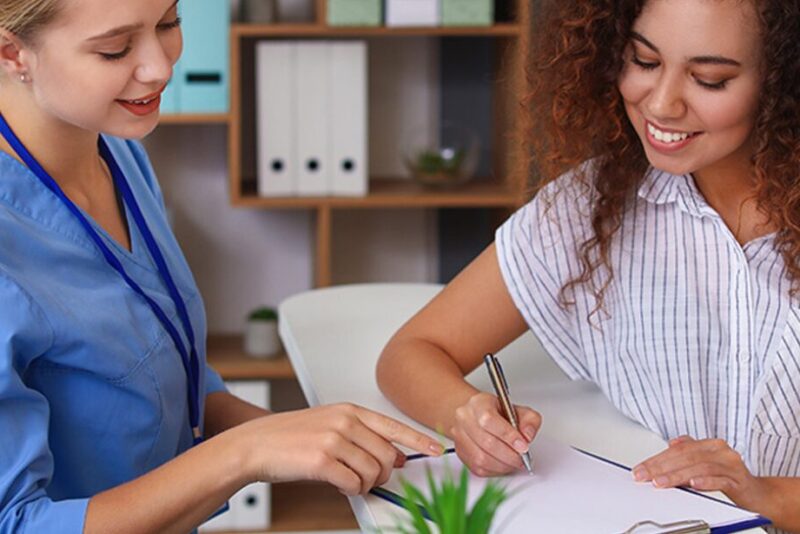 women going over checklist