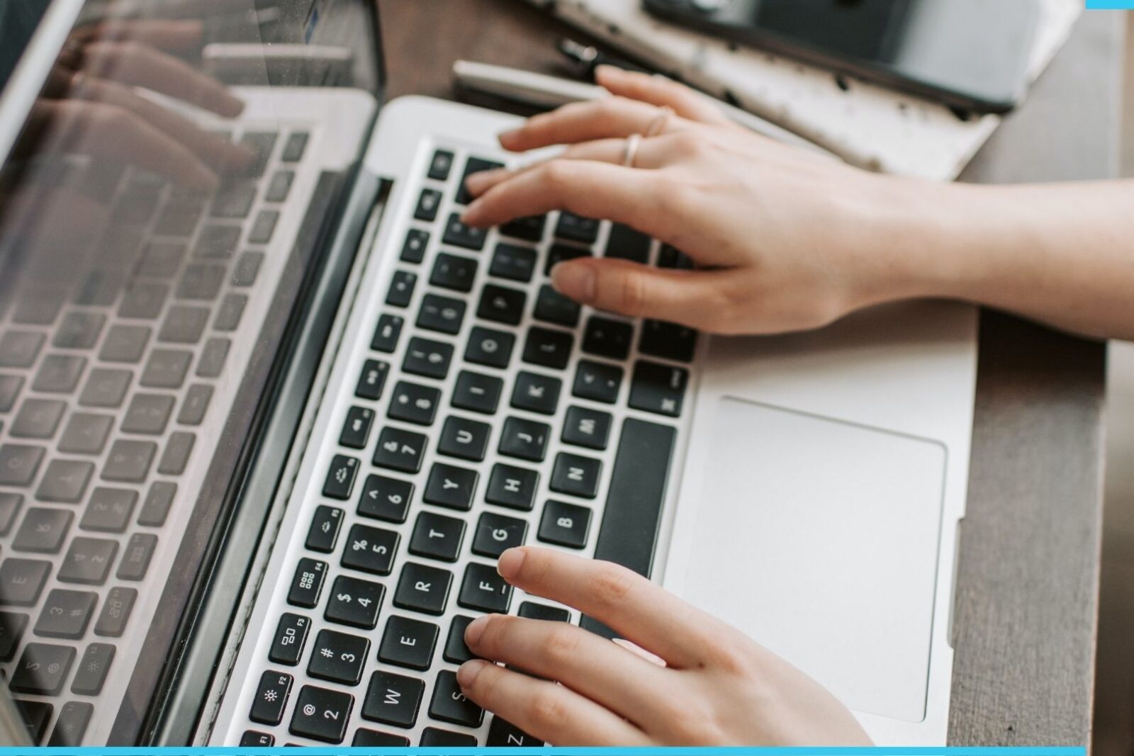 a person typing on a laptop