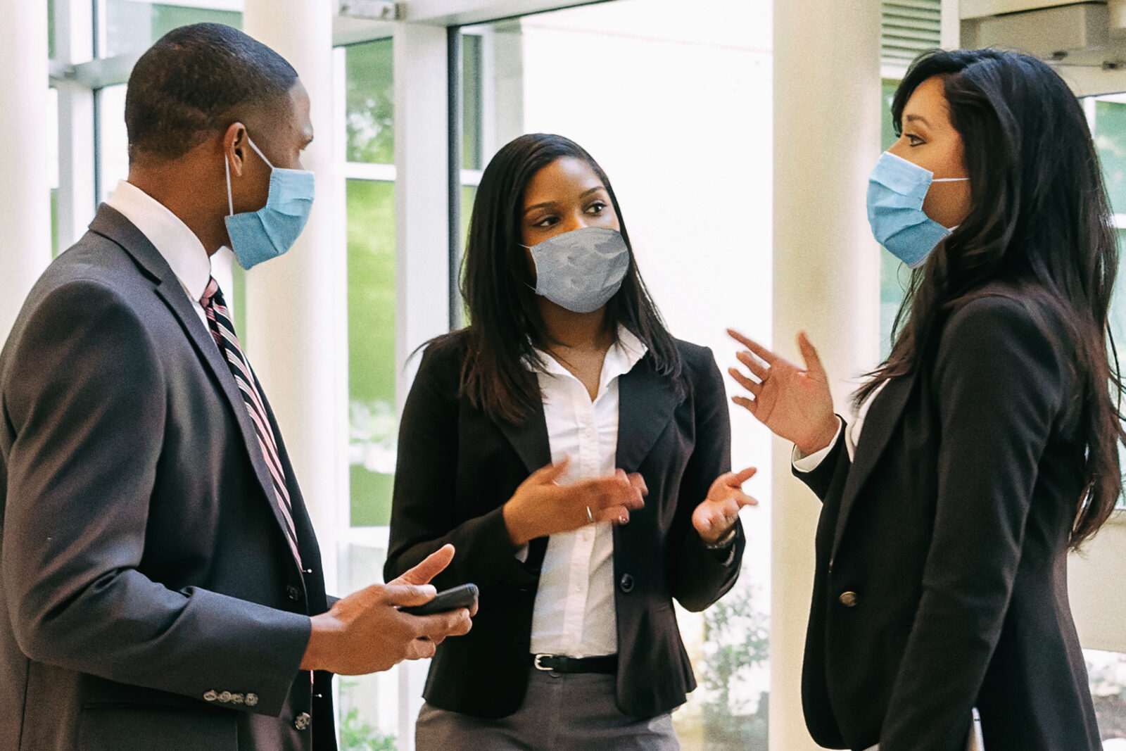 a group of people wearing masks
