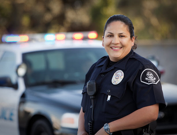 police officer staying next to police car