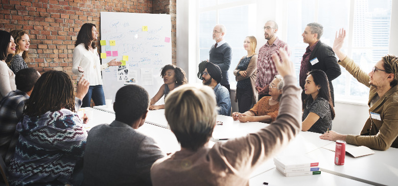 a group of people in a meeting