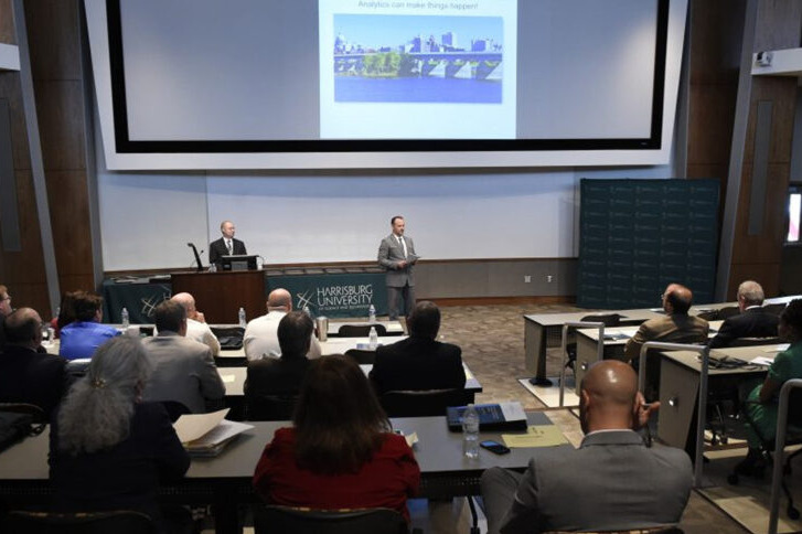 a person giving a presentation to an audience