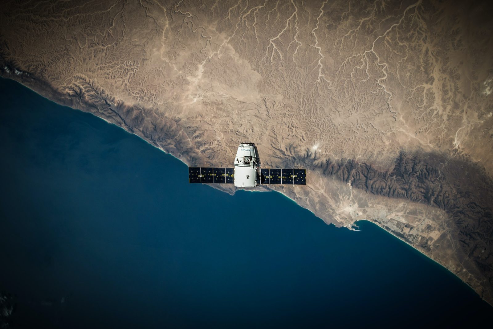 a space ship over the ocean