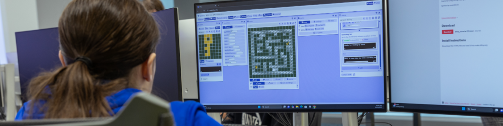 student creating computer game