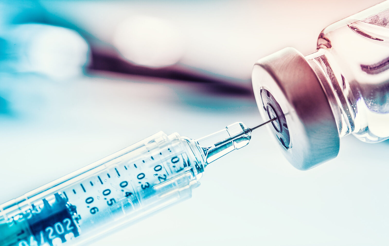 a close-up of a syringe and a tube