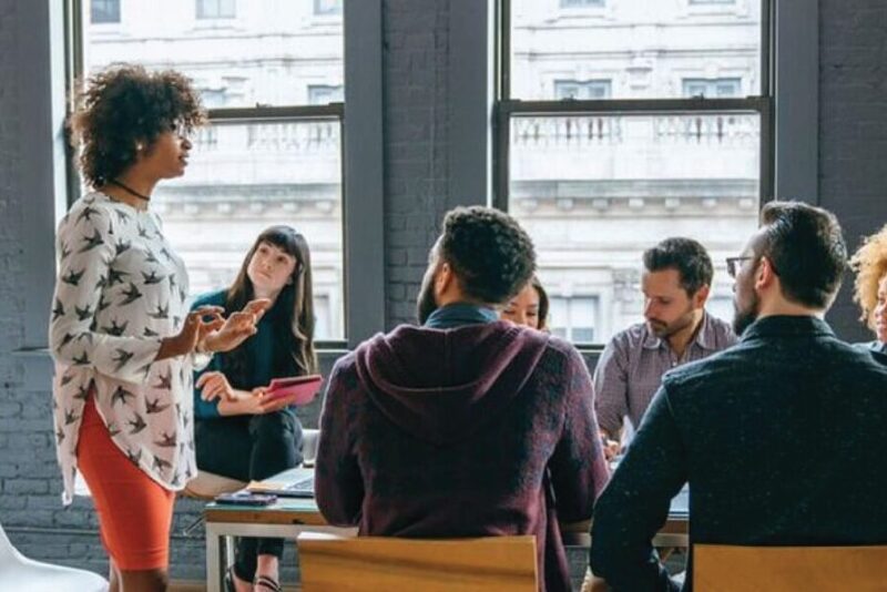 women leading meeting