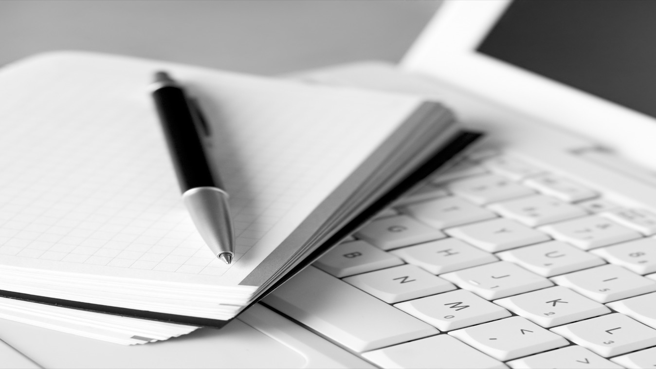 a pen on a laptop